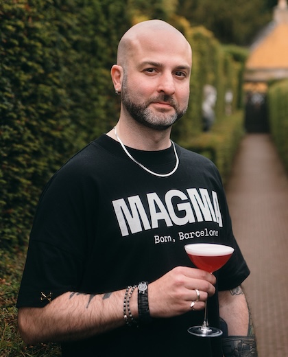 Irakli "Lee" Agladze holding a cocktail at MAGMA